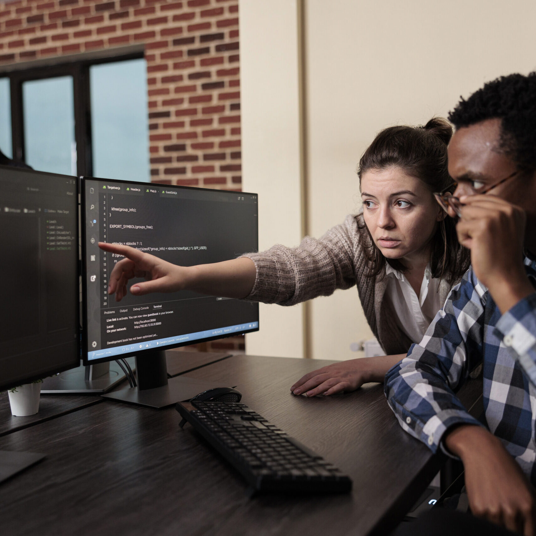 Caucasian software developer signaling on screen data breach and deactivated security system. Tech engineer observing multiple system security breaches caused by overloaded storage servers.